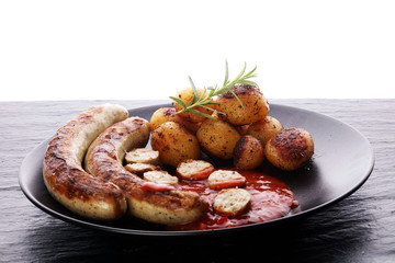 grilled sausages and potatoes