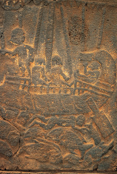 Hittite relief depicting a victory of a warship. Commander has a drink in his hand sitting in the bow. Corpses of enemy floating
