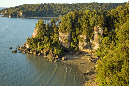 Aerial view of lowland rainforest and rocky coastline of Bako National Park, Sarawak Borneo Malaysia.