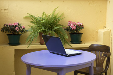 computer in the urban terrace in summer