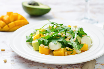 Avocado mango arugula pine nuts Mozzarella salad