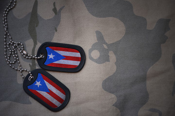 army blank, dog tag with flag of puerto rico on the khaki texture background. military concept