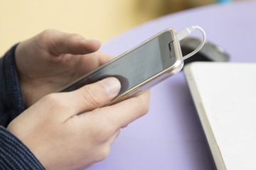 hands of child with phone mobile, closeup