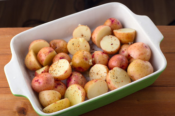Segments of young raw potato in spices