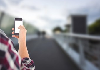 young men's hand with phone in a bridge