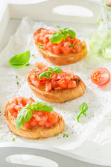 Delicious bruschetta with tomato and basil for breakfast