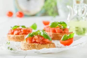 Delicious bruschetta with basil and tomato for breakfast