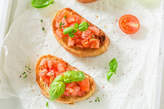 Crisp bruschetta with tomato and basil for a snack