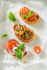 Healthy mix of bruschetta with fresh ingredients for breakfast