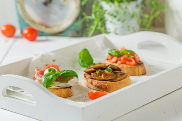 Homemade various bruschetta with fresh ingredients for a snack