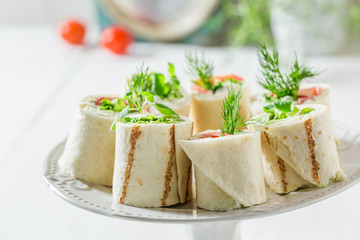 Tasty tortilla with salmon, cheese and vegetables for a brunch