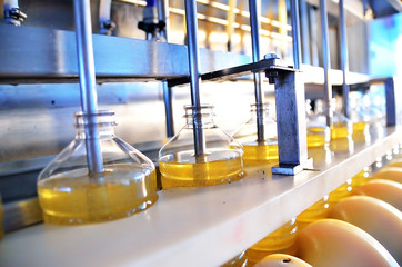 Sunflower oil. Factory line of production and filling of refined oil from sunflower seeds. Factory conveyor of food industry