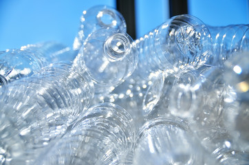 Bottle. Industrial production of plastic pet bottles. Factory line for manufacturing polyethylene bottles. Transparent food packaging