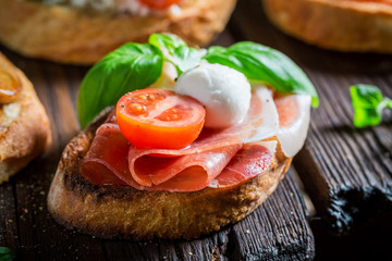 Tasty mix of bruschetta with fresh ingredients for a snack