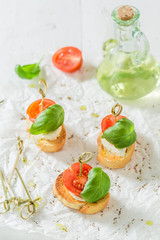 Fresh crostini made with mozzarella and tomato for a snack
