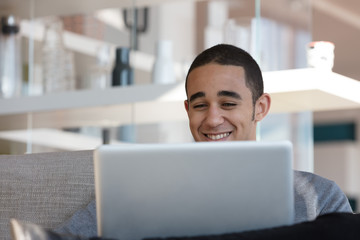 Smiling man with laptop