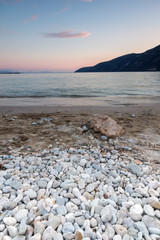 Sunset view on the beach of village of Vasiliki, Lefkada, Ionian Islands, Greece