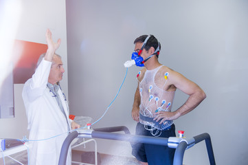 Man doing a stress test of the heart running on a machine