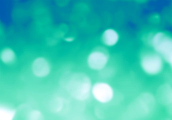 Fototapeta premium Green bokeh glittering diamond stars flakec copyspace background