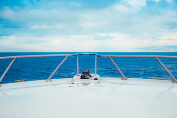 Fototapeta na wymiar Bow of a Boat sailing through clear blue water - Pacific Ocean, Coast of Mexico