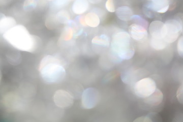 Glittering festive silver white blank blurry bokeh background