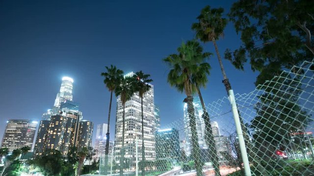 Los Angeles Downtown Skyscrapers Freeway Traffic Time Lapse with Pam Trees 
