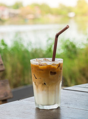Cold coffee on wooden table