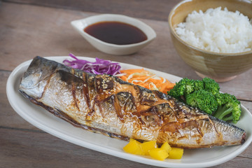 Grilled saba fish with sweet sauce on plate and rice