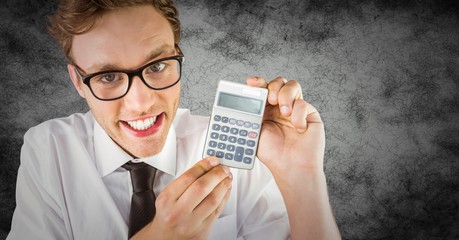 Nerd with calculator against grunge background