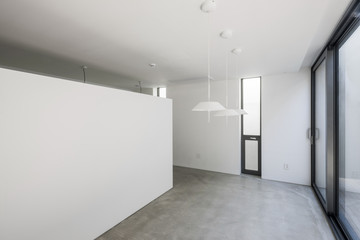 white empty office, showroom with pendant lighting, window.