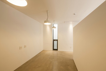 white empty office, showroom with pendant lighting, window.