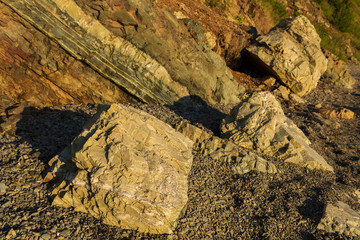 Rock on the city beach on Ozernovskaya spit, shore of Avacha Bay in Petropavlovsk-Kamchatsky.