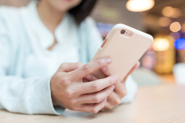 Woman text on cellphone