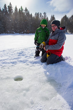 Mixed Race Family Ice Fishing