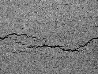 Obraz premium crack asphalt road background
