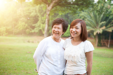 Fototapeta premium Asian elderly mother and grown daughter