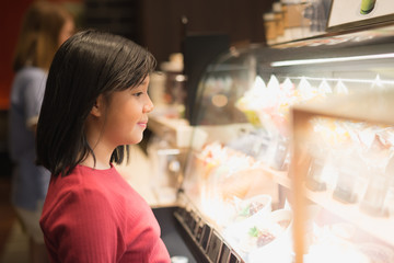 Asian girl choosing ice-cream