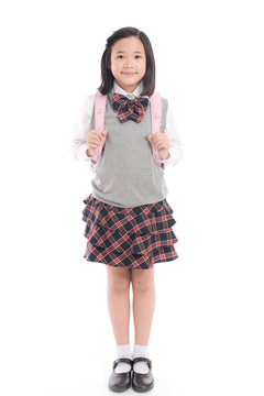 Asian child in school uniform with pink school bag on
