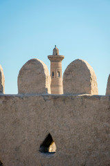 Fototapeta na wymiar Old city wall and minaret, Khiva, Uzbekistan