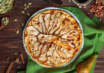 Top view of Pear tart with cheese on rustic wooden table