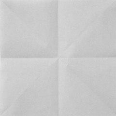 White sheet of paper folded in four