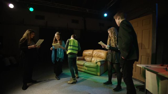 Young student actors in rehearsal for school theatre production