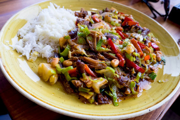 Mexican hot meat salad served with rice