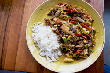 Mexican hot meat salad served with rice