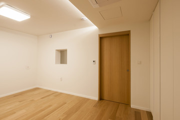 empty white room with wood door.
