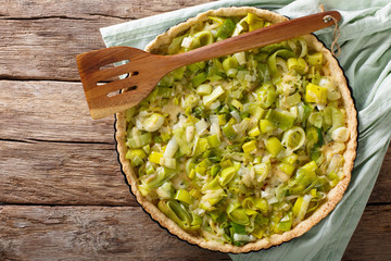 Delicious Savory leek flan with cheese close-up. Horizontal top view