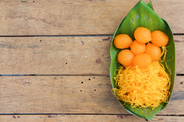 Sweet Golden Drop and Golden Egg strips, Thai dessert in bananas leafs

