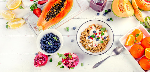 Breakfast with fruit, muesli and berries
