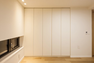 white empty room with wardrobe, window, door at the night.