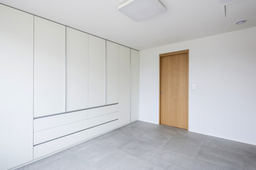 white empty room with window, wardrobe, door at the day.